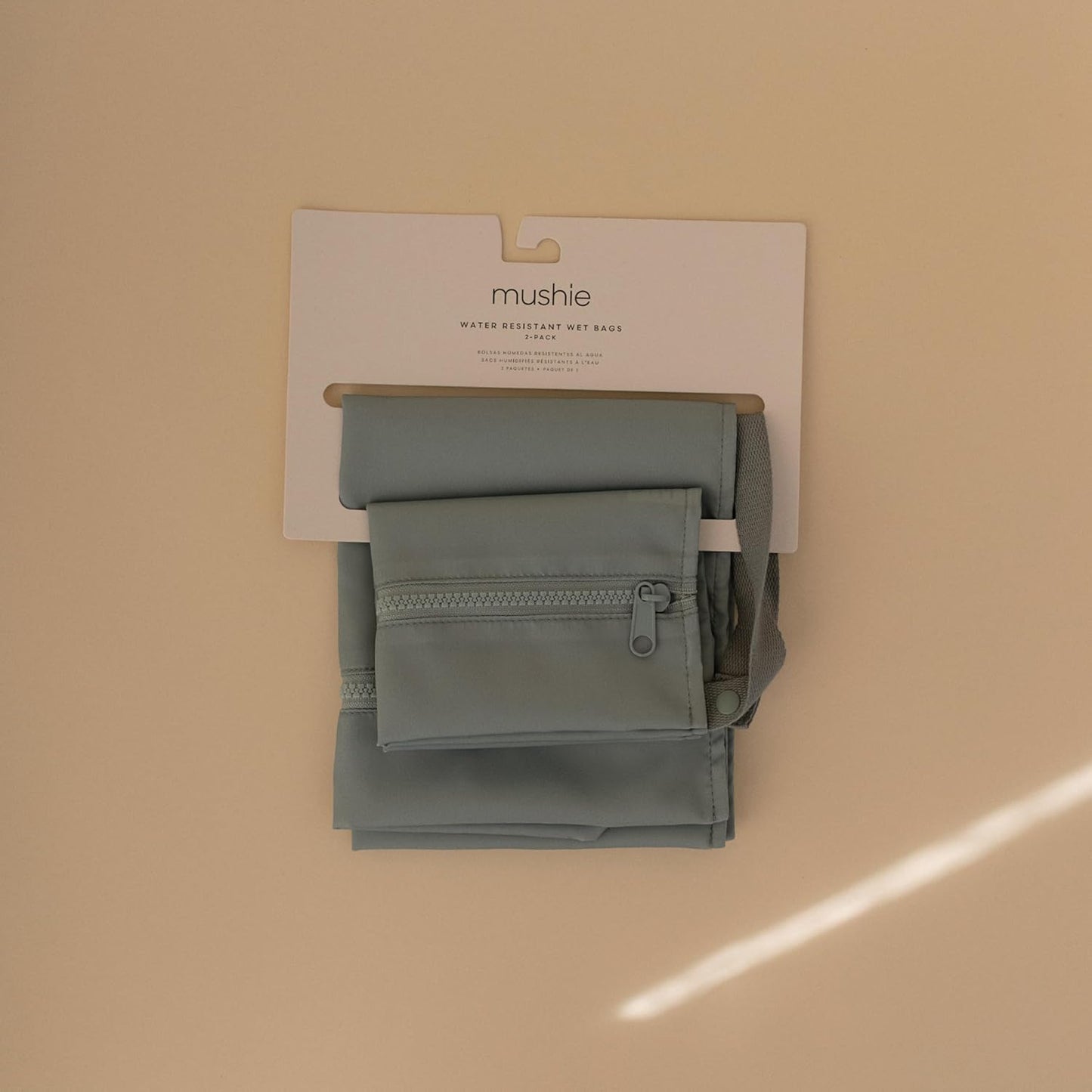 mushie Water Resistant Wet Bags | Large & Small Reusable Storage Bag for Baby Items and Travel | Zippered Pockets with Handle | Machine Washable, Set of 2 (Roman Green)