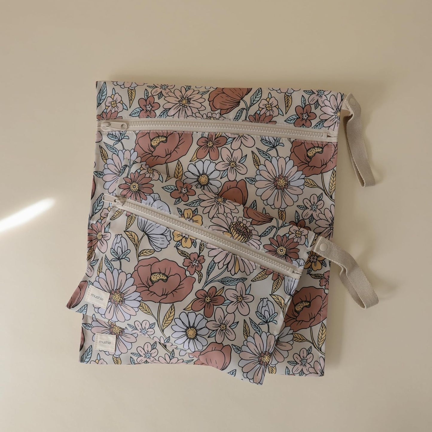 mushie Water Resistant Wet Bags | Large & Small Reusable Storage Bag for Baby Items and Travel | Zippered Pockets with Handle | Machine Washable, Set of 2 (Retro Flowers)